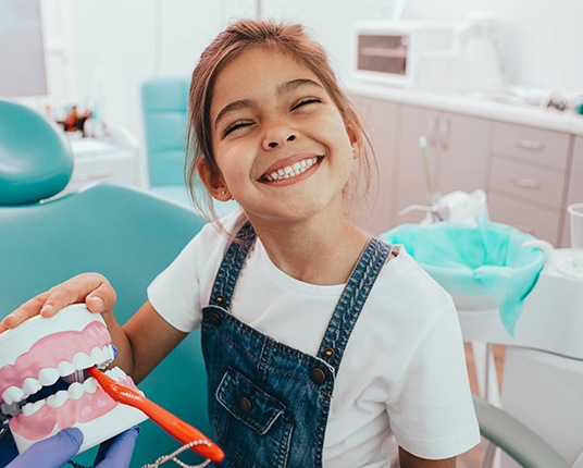 Child getting a dental checkup in Hamilton