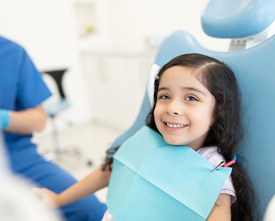 Child getting a dental cleaning in Hamilton