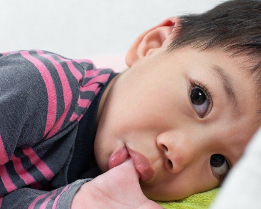 Young child sucking thumb