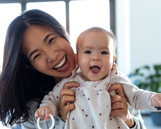 Woman and baby smiling in Hamilton