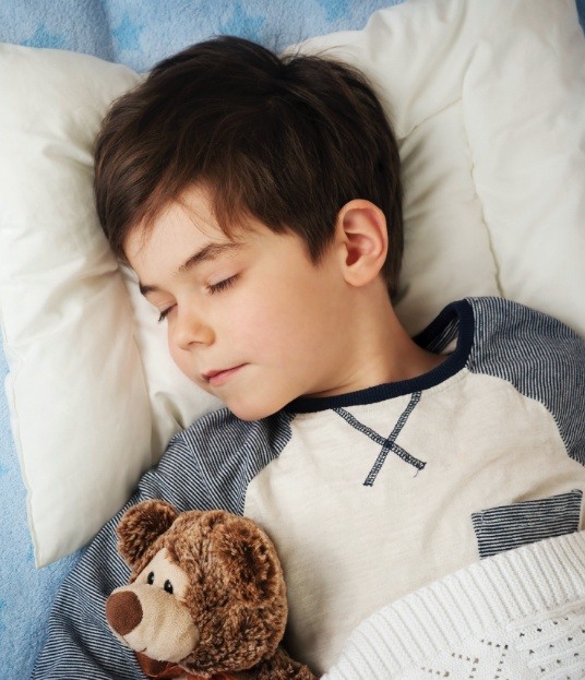 Child relaxing after sedation dentistry