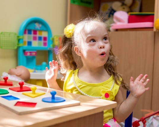 Young girl smiling after special needs dentistry visit