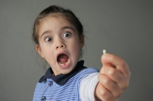 a child with a knocked-out tooth in Hamilton