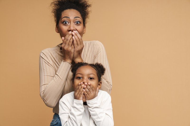 Patient and child gasp after losing dental crown