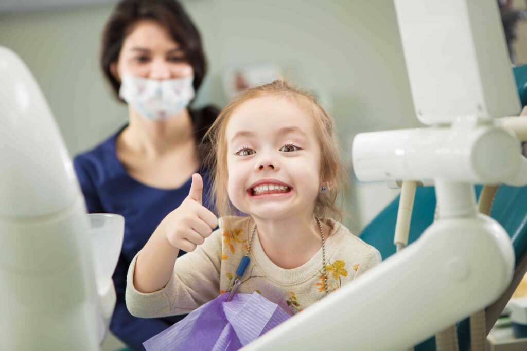 Child smiling at the dentist