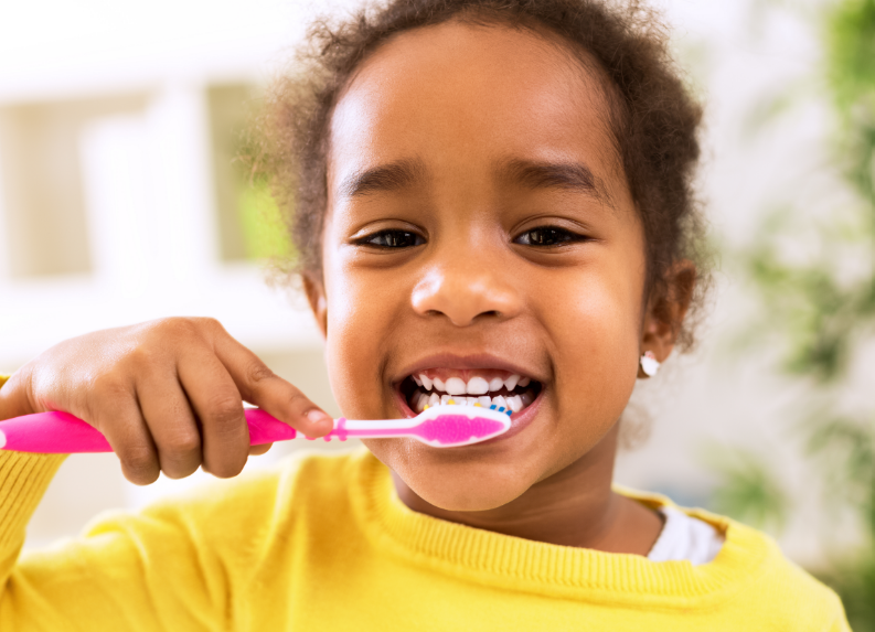 Little girl brushing teeth