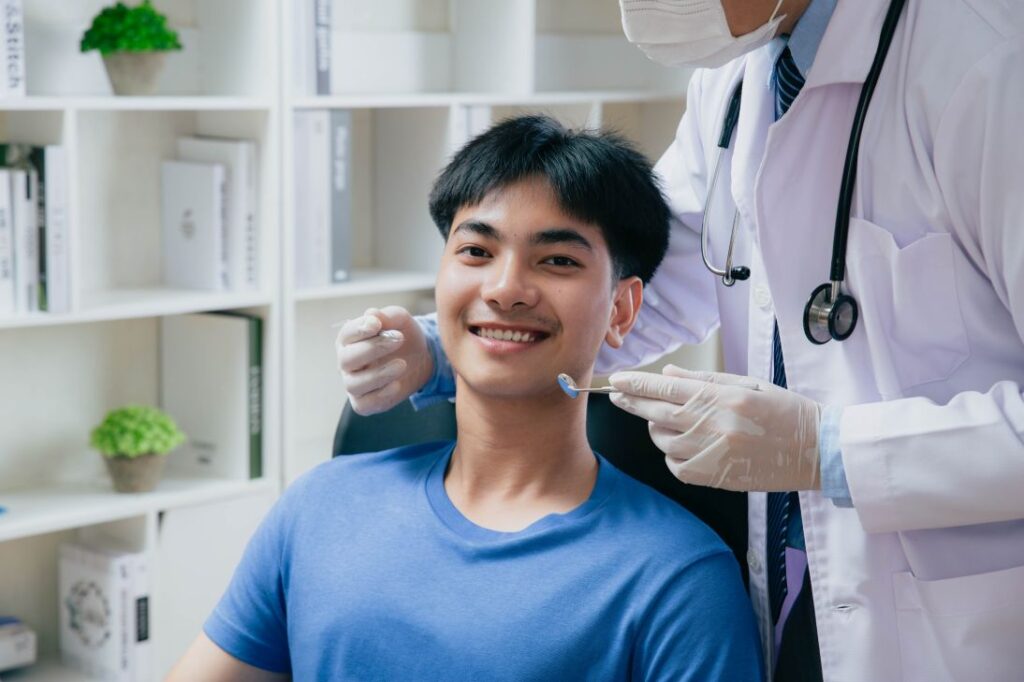 A teenage boy at the dentist